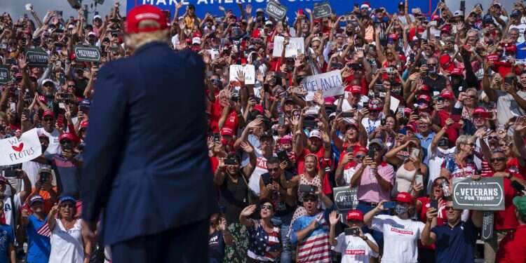 Supporters cheer as US President Donald Trump arrives for a campaign rally outside Raymond James Stadium, Thursday, in Tampa The home stretch: Pennsylvania, Florida likely to decide the winner