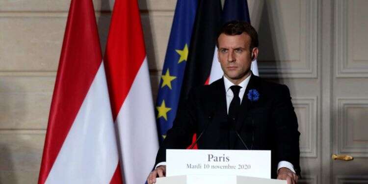 French President Emmanuel Macron looks on as he attends a conference in Paris, Monday France, Germany push for tighter EU borders after attacks