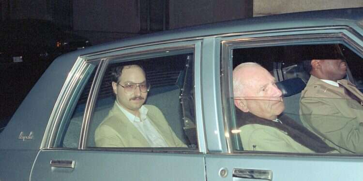 Jonathan Pollard sits in the back of a government vehicle after appearing in US District Court A saga that tested US-Israel relations