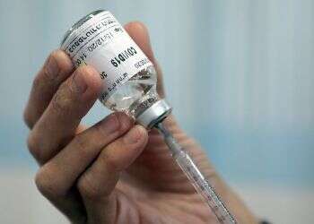 Government mulls new corona restrictions as vaccination drive gets underway