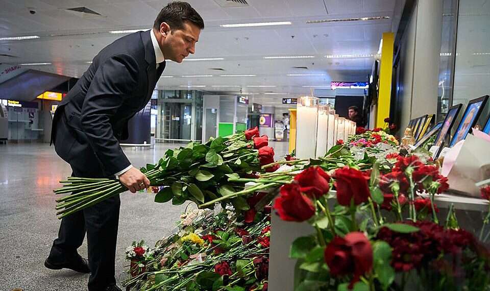 Ukraine's President Volodymyr Zelensky places flowers at a memorial for the victims of the Ukraine International Airlines Boeing 737-800 crash in the Iranian capital Tehran Iran to pay families of victims of Ukraine plane crash $150,000 each