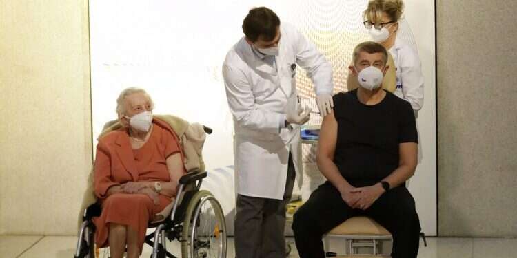 World War II veteran Emilie Repikova, left, watches as Czech Republic's Prime Minister Andrej Babis receives a vaccine against COVID-19 at the military hospital in Prague, Sunday, Dec. 27 'A beautiful day': EU nations kick off coordinated COVID vaccination effort