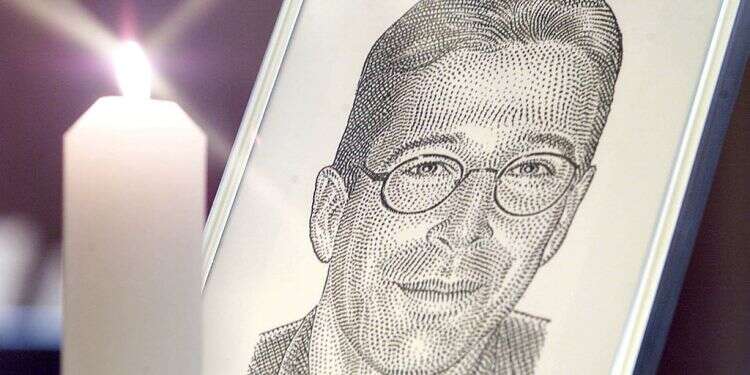 A portrait of Wall Street Journal's reporter Daniel Pearl stands with a candle at the altar at Fleet Street's journalists chapel St Brides Church prior to a memorial service in London, March 5, 2002 Terrorist convicted of beheading US journalist Daniel Pearl to go free