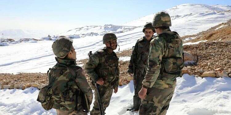Syrian Army soldiers holding their positions at the snow-covered Jabal al-Sheikh, also known as Mount Hermon, on the Lebanese-Israeli border, Jan. 25. 2021 Report: Syrian troops take positions on Lebanese side of Mount Hermon