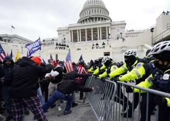 Trump supporters try to break through a police barrier, Wednesday, 'Disgraceful' violence by Trump protesters shocks foreign leaders