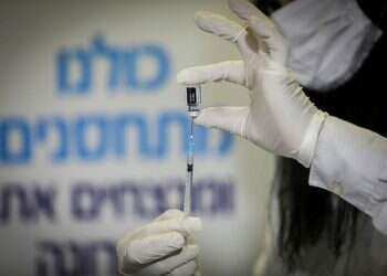 Israeli vaccinated for COVID while positive for virus hospitalized with rare reaction