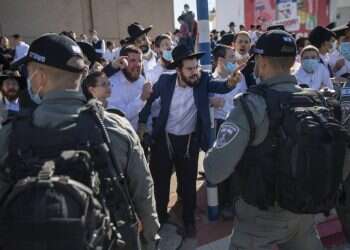 ltra-Orthodox Jews argue with Israeli border police officers during a protest over the coronavirus lockdown restrictions, in Ashdod, Jan. 24, 2021 Is COVID lockdown a violation of Haredi community's rights?