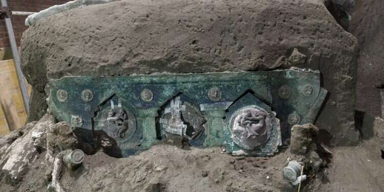 A chariot, with its iron elements, bronze decorations and mineralized wooden remains, that was found in Civita Giuliana, north of Pompeii, Feb. 27, 2021 Archaeologists find intact ceremonial chariot near Pompeii