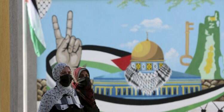 Women waiting at the registration station of the Central Elections Commission in Gaza City, Feb. 10, 2021 Gazans hope to vote after years of Hamas rule
