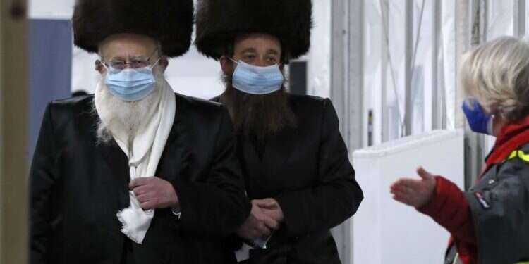 Ultra-Orthodox Londoners roll up sleeves to fight COVID