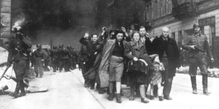 A group of Polish Jews are led away for deportation by SS soldiers during the destruction of the Warsaw ghetto after an uprising in the Jewish quarter Future of Holocaust research in Poland hinges on libel case