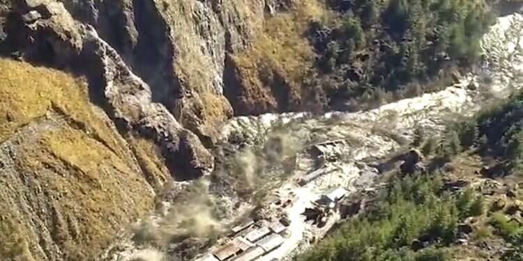 A massive flood of water, mud and debris flowing at Chamoli District after a portion of Nanda Devi glacier broke off in Tapovan area of the northern state of Uttarakhand, India, Sunday, Feb. 7 Himalayan glacier breaks in India, some 125 missing in floods