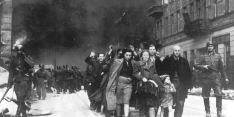 A group of Polish Jews are led away for deportation by German SS soldiers during the destruction of the Warsaw Ghetto 'The pursuit of SS perpetrators must not end'