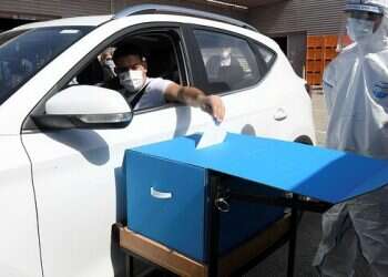 Seeking to defeat pandemic fears, Israeli elections employ high-tech solutions, old-school safeguards