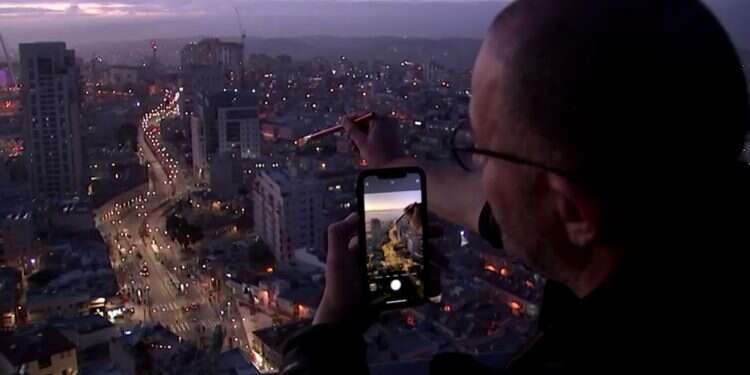 Artist Eitan Asraf in action Brush with death inspires Israeli artist's surreal cellphone snaps