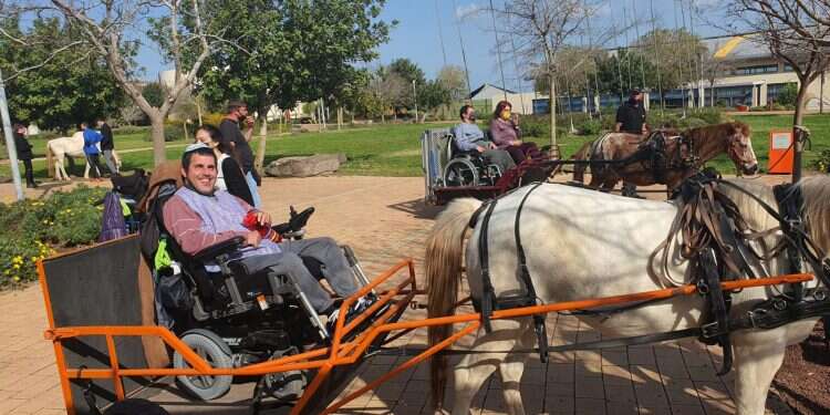A resident of the Grabski Center enjoys a carriage ride With restrictions lifted, disabled community finally able to get much-needed outing