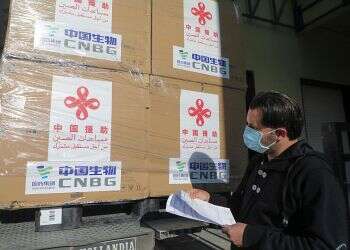 A Palestinian worker unloads a shipment of the Sinopharm COVID-19 vaccines donated by the Chinese government in the West Bank city of Nablus, March 29, 2021 China donates 100,000 doses of Sinopharm coronavirus vaccine to Palestinians