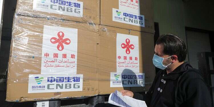 A Palestinian worker unloads a shipment of the Sinopharm COVID-19 vaccines donated by the Chinese government in the West Bank city of Nablus, March 29, 2021 China donates 100,000 doses of Sinopharm coronavirus vaccine to Palestinians