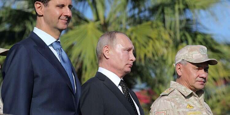 Syrian counterpart Bashar Assad, Russian President Vladimir Putin and Russian Defense Minister Sergei Shoigu at Hmeimim air base in the northwestern Syrian province of Latakia, December 11, 2017 'Israel doesn't jeopardize Russian interests in Syria'