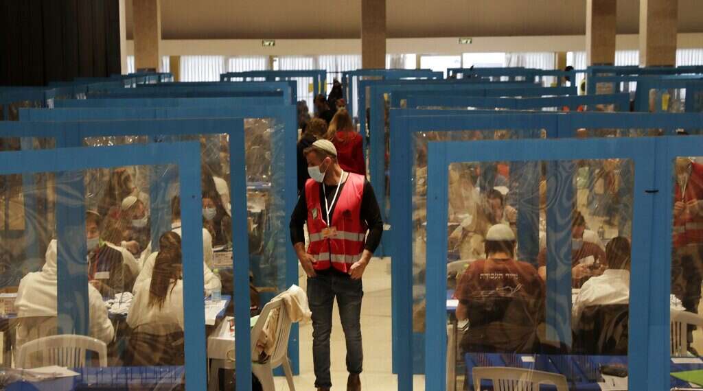 Workers are divided by plastic screens as votes are counted in Jerusalem It's official: Election ends in gridlock after all ballots counted