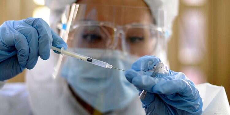 A health worker prepares a dose of the Russian Sputnik V vaccine, April 27, 2021 Turkey signs deal for 50 million Sputnik V coronavirus vaccines