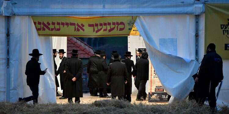 Hassidic visitors worry Hungarian village under strain from COVID