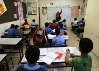 Children attend a class in a school in east Jerusalem in 2017 EU Parliament condemns UNRWA for 'teaching hate, violence' in PA schools