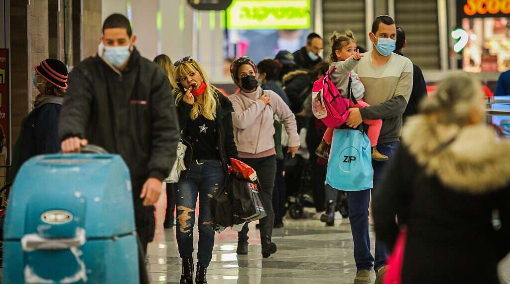 Shoppers are seen at Jerusalem's Hadar Mall, Feb. 22, 2021 Israel to end most COVID restrictions June 1