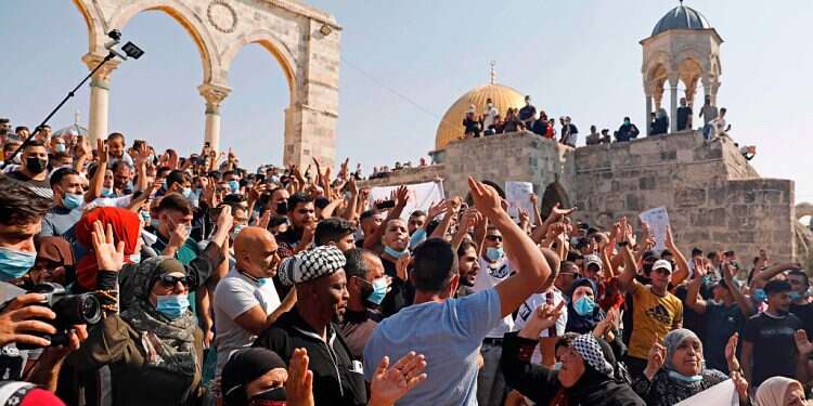 Palestinians protest outside the Dome of the Rock in the Al-Aqsa Mosque compound in the Old City of Jerusalem Can Israeli restraint keep peace in Jerusalem?