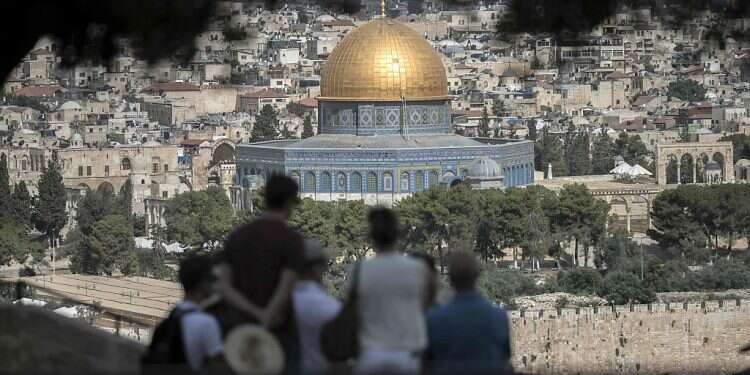 Tourists visit the Mount of Olives in Jerusalem 2020 saw more people visit Jerusalem than Tel Aviv, Tourism Ministry says
