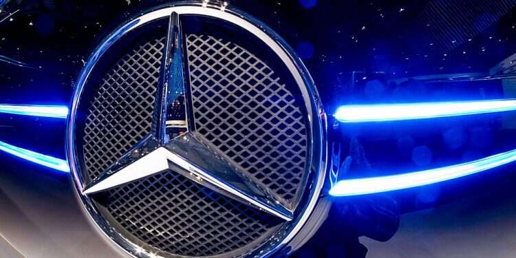 The logo of Mercedes Benz is pictured at the booth of the Daimler AG on the grounds of the IAA Nutzfahrzeuge (IAA Commercial Vehicles) fair on Sept. 21, 2016 in Hanover, northern Germany Mercedes-Benz, startup UBQ Materials win automotive sustainability award