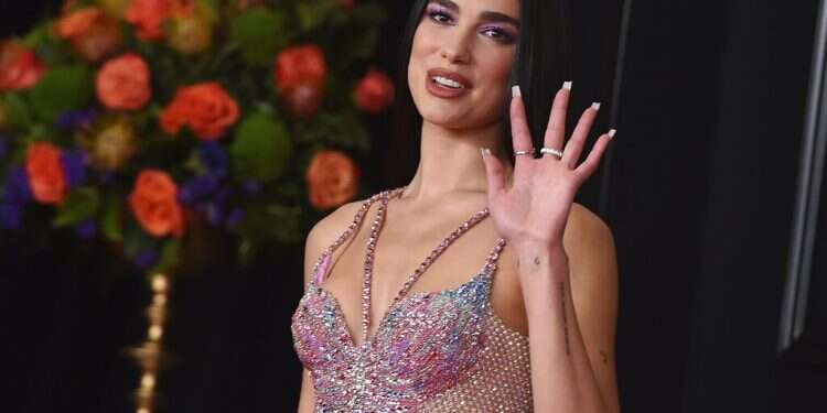 British singer Dua Lipa arrives at the 63rd annual Grammy Awards in Los Angeles, March 14, 2021 Following criticism, singer Dua Lipa denies antisemitism charges