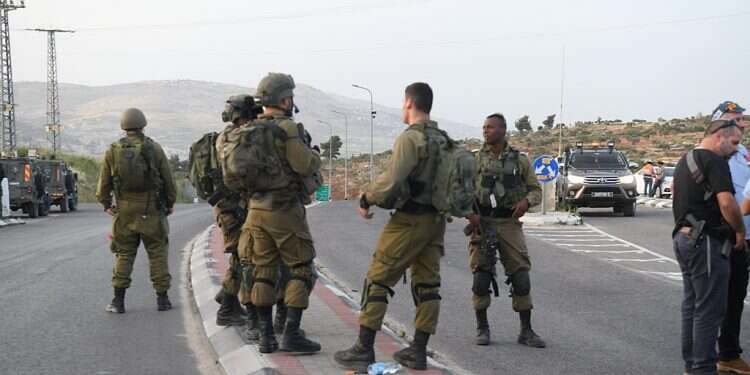 IDF troops at the scene of the Tapuach Junction shooting, Sunday, May 1, 2021 Security forces arrest suspects in Samaria attack, shooter still at large
