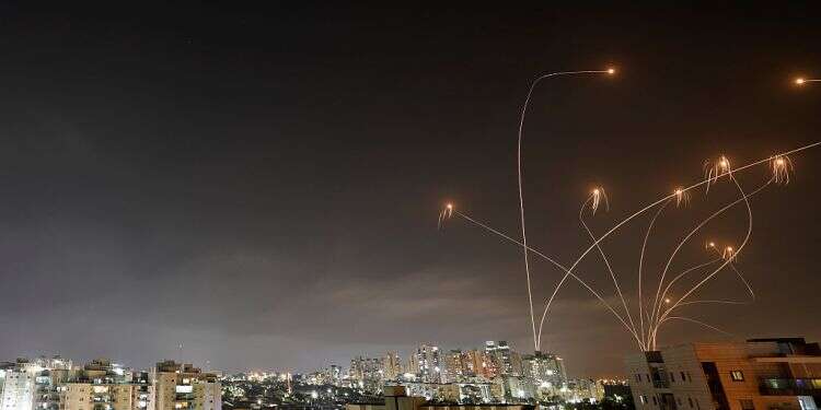 Massive barrage targets Tel Aviv area, at least 1 killed