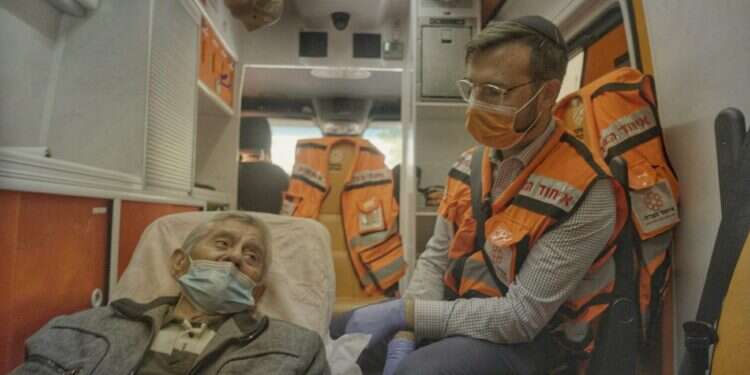 A volunteer in United Hatzalah helps an Israeli patient United Hatzalah telethon declared success after $1.3M raised
