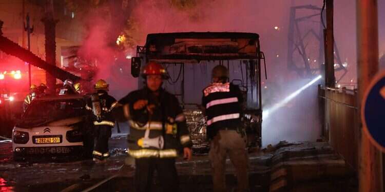 The burnt carcass of a bus that sustained a direct hit by a Hamas rocket in Holon, a suburb of Tel Aviv, May 11, 2021 Violence upends Biden's Israel-Palestinian outlook