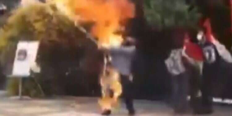 Iranian tries to burn Israeli flag, sets himself on fire