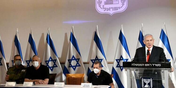 Prime Minister Benjamin Netanyahu addresses the nation on TV Friday at the conclusion of Operaton Guardian of the Walls. Seated to his left are Defense Minister Benny Gantz, IDF Chief of Staff Lt. Gen. Aviv Kochavi, and Shin Bet security agency director Nadav Argaman Netanyahu thanks Israelis for 'standing strong' during Gaza op