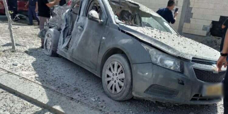 A car in Beersheba following a rocket barrage on May 20, 2021 Intense rocket fire targets south as ceasefire remains elusive