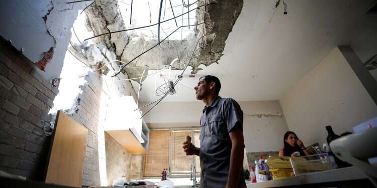 Ashkelon family holds on after rocket hits their home
