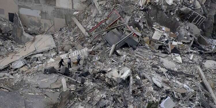 Search and rescue personnel work in the rubble of a 12-story residential tower that partially collapsed on June 24, 2021 in Surfside, Florida 18 Jews reportedly missing in Florida tragedy as search for survivors continues