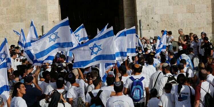 Flag march held in Jerusalem amid riots in city, threats from Hamas