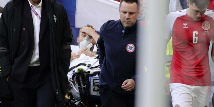 Paramedics evacuate Denmark's Christian Eriksen off the field after he collapsed during the Euro 2020 soccer championship group B match between Denmark and Finland, June 12, 2021 Euro 2020: Christian Eriksen collapses on the field