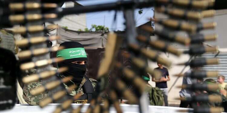 A member of the Izzadin al-Qassam Brigades, Hamas military wing, during a rally in Rafah, May 28, 2021 'Western countries to see adversaries employ Hamas, Hezbollah tactics'