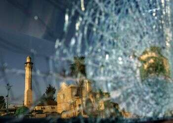 Can riot-stricken mixed city piece together fragile coexistence?