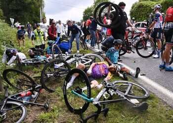 Fan sign causes massive pileup on first day of Tour de France