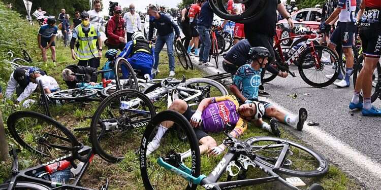 Fan sign causes massive pileup on first day of Tour de France