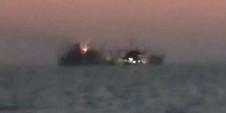 An Iranian navy vessel on fire in the Gulf of Oman, Wednesday, June 2, 2021 On board fire sinks largest ship in Iranian navy in Gulf of Oman