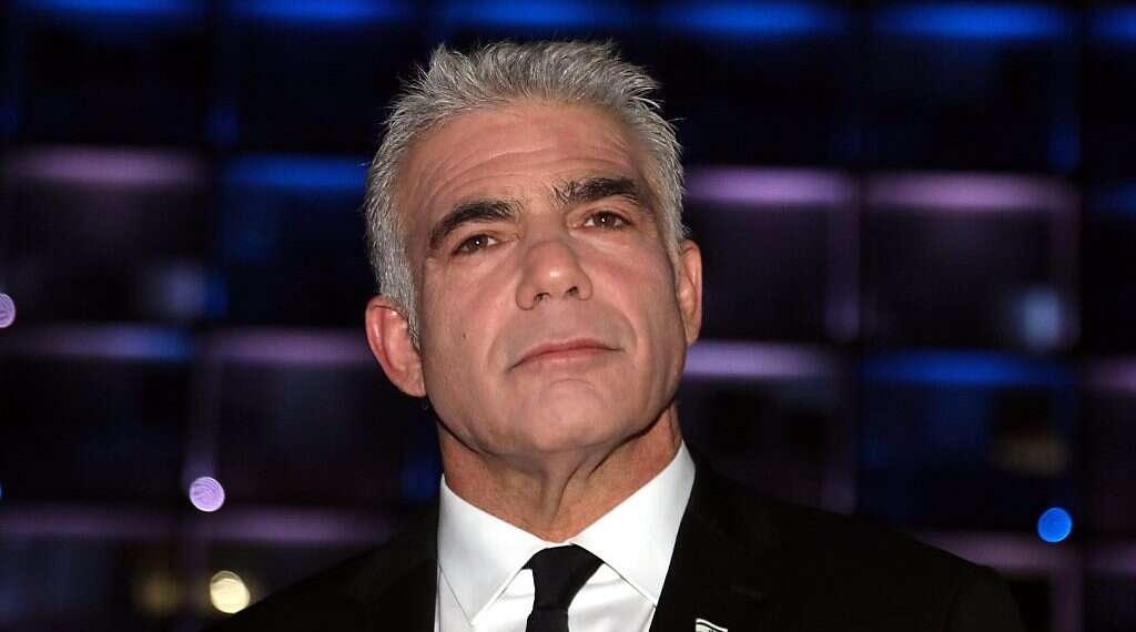 Foreign Minister Yair Lapid Lapid: Polish law to limit WWII restitutions 'a disgrace'