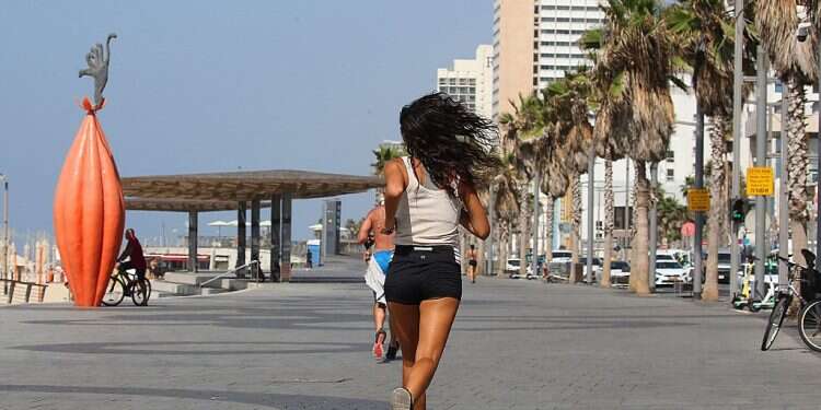 Israelis run on the Tel Aviv boardwalk on Sept. 29, 2020 Israel 2nd-biggest user of running app JoggingBuddy